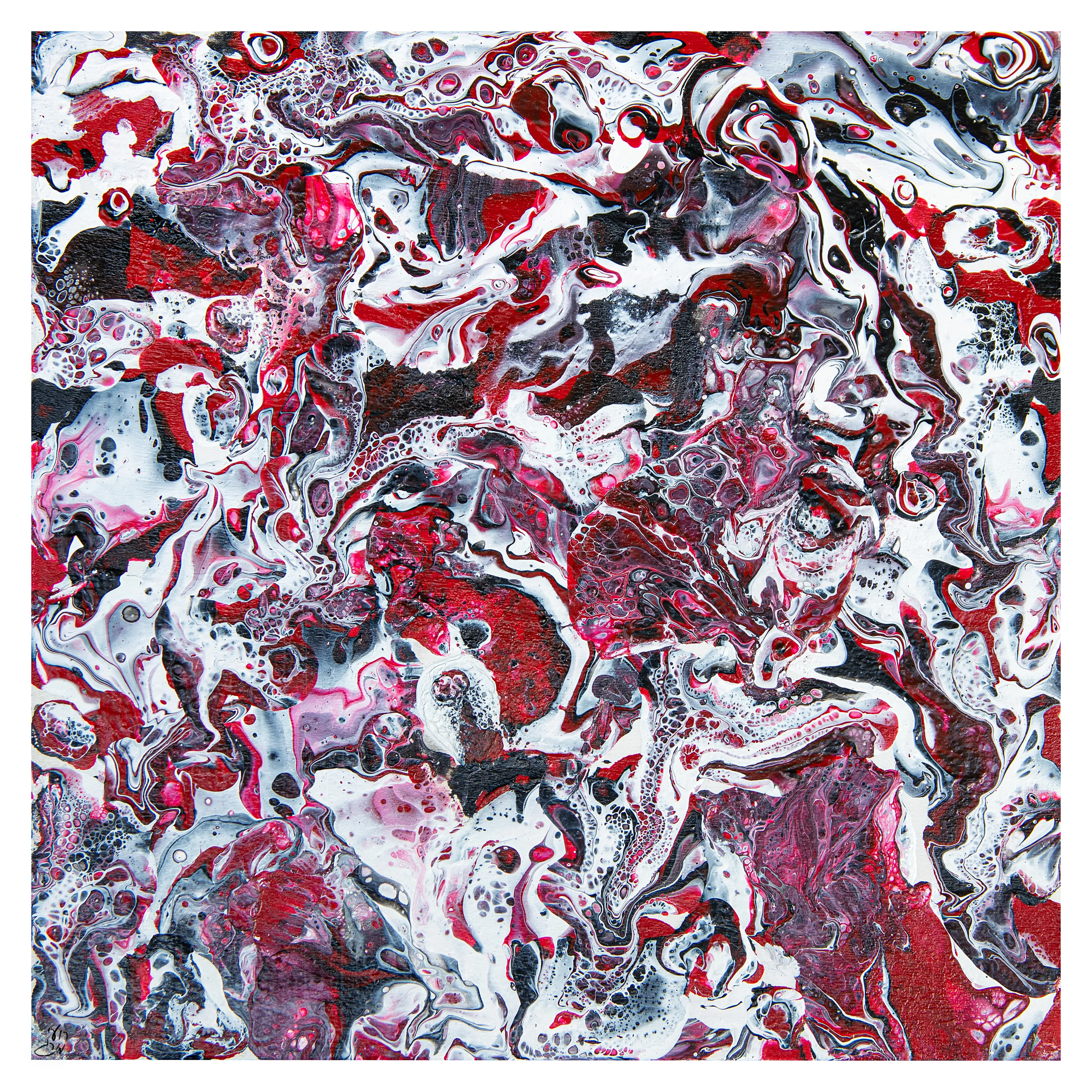 Swirling poured paint in red, white, black and pink.