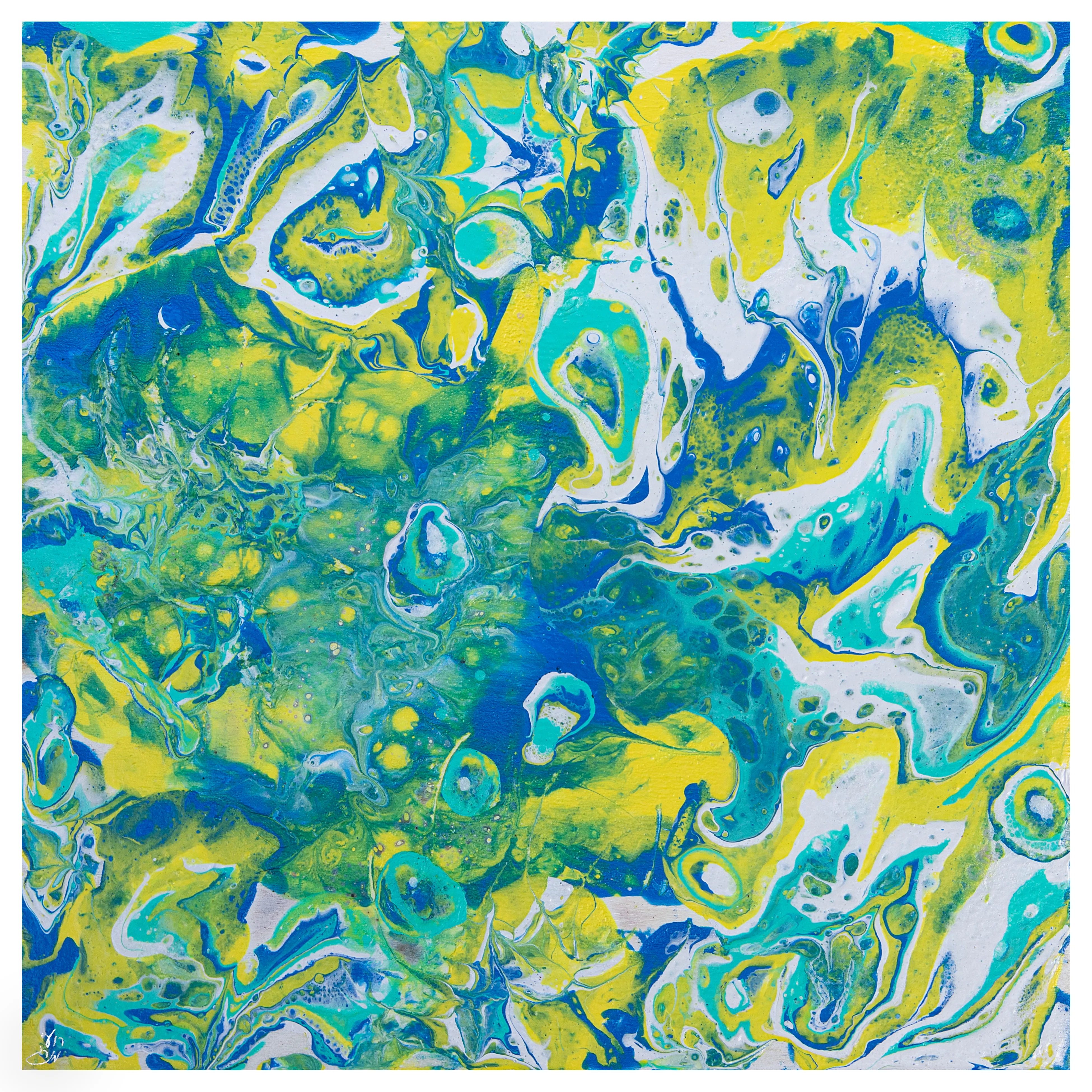 Swirling poured paint in yellow, green, turquoise and white.