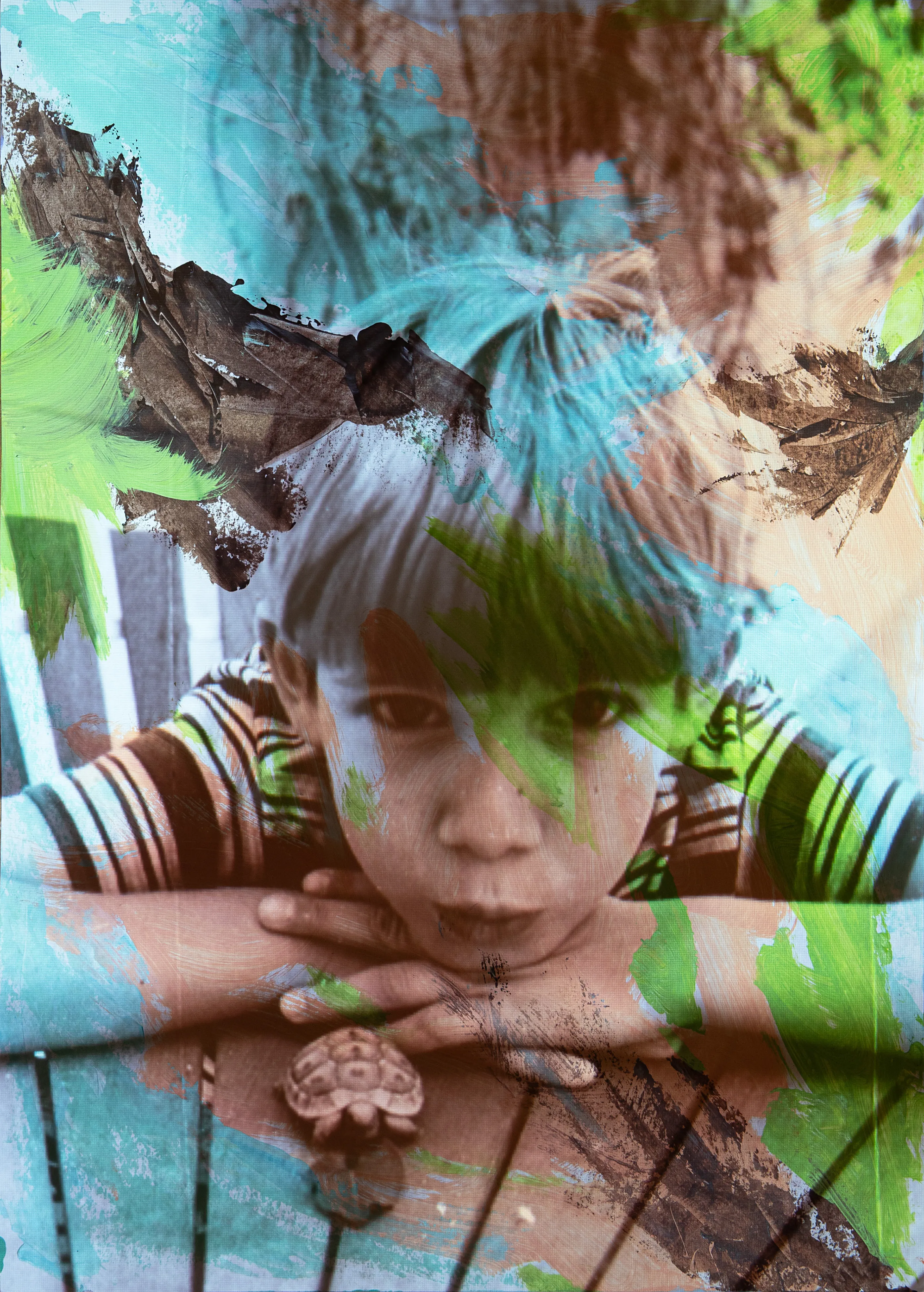 A boy in a striped shirt rests his chin on his hands behind a fence, with teal and brown paint across the photograph.