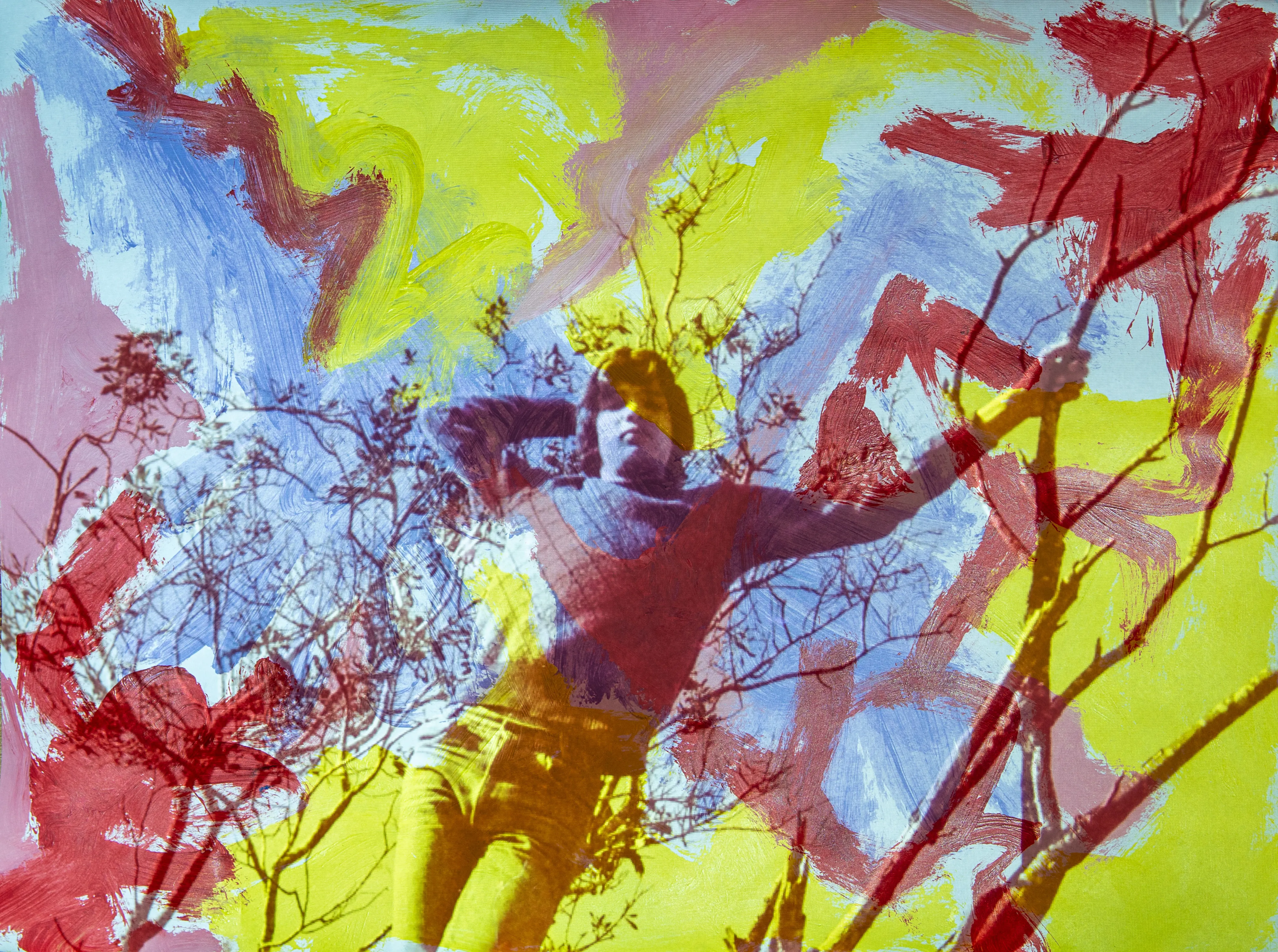 A figure with arms outstretched among red branch-like lines on yellow and blue paint.